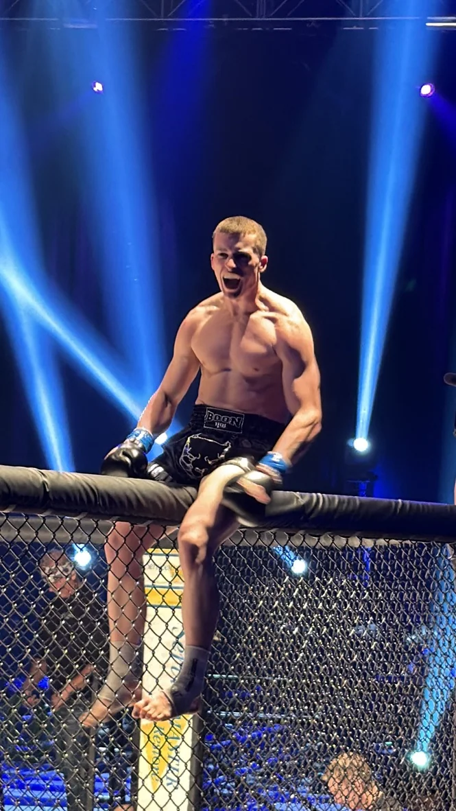 TCB fighter in the cage